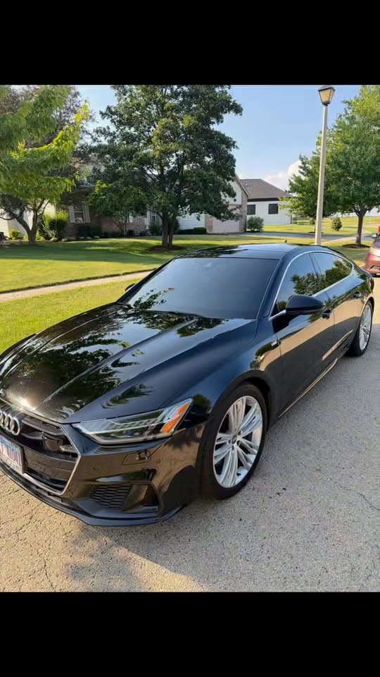 Glossy black Audi after exterior detailing