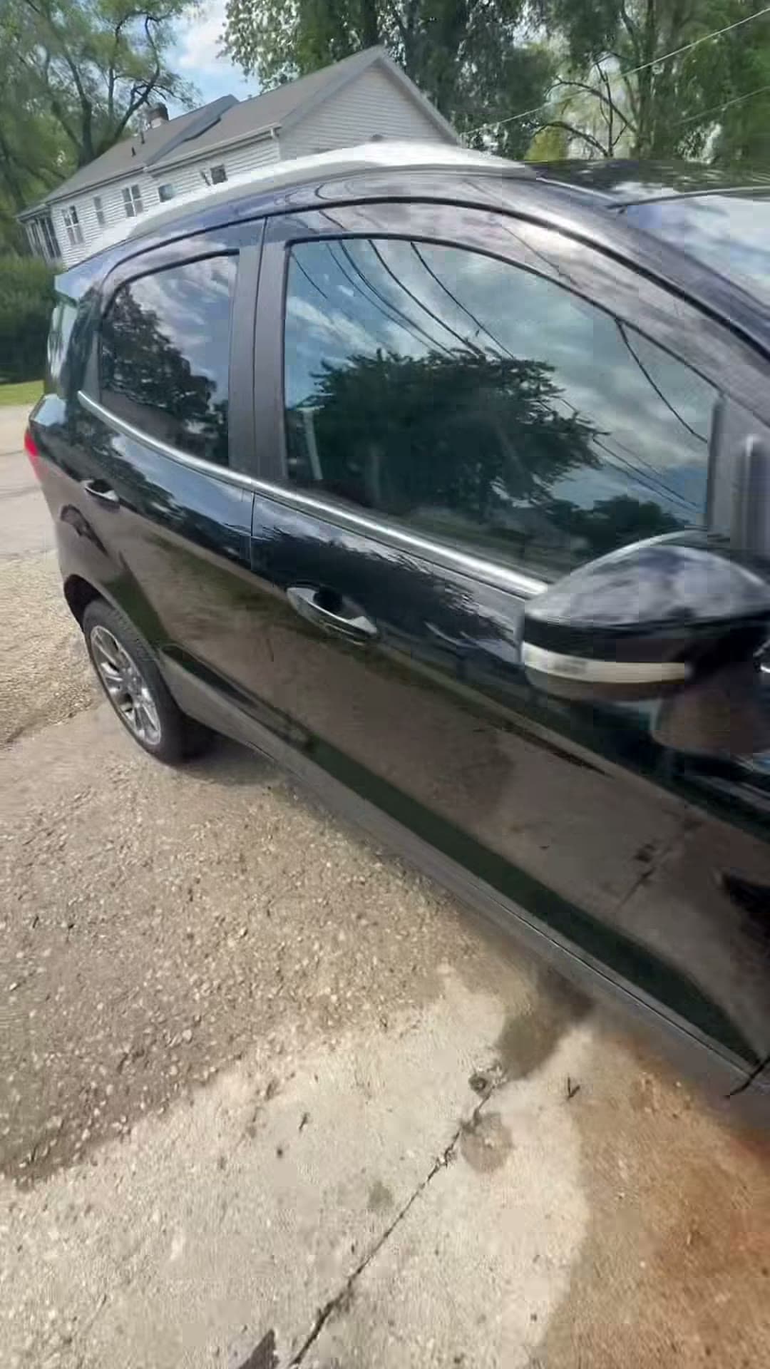 Finished black Ford Explorer viewed along the side