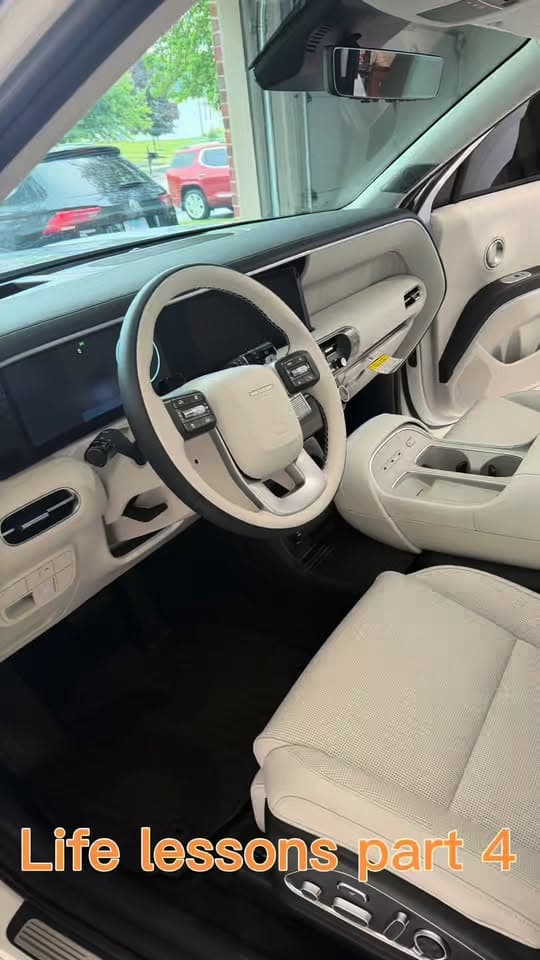 Light-colored vehicle interior after detailing