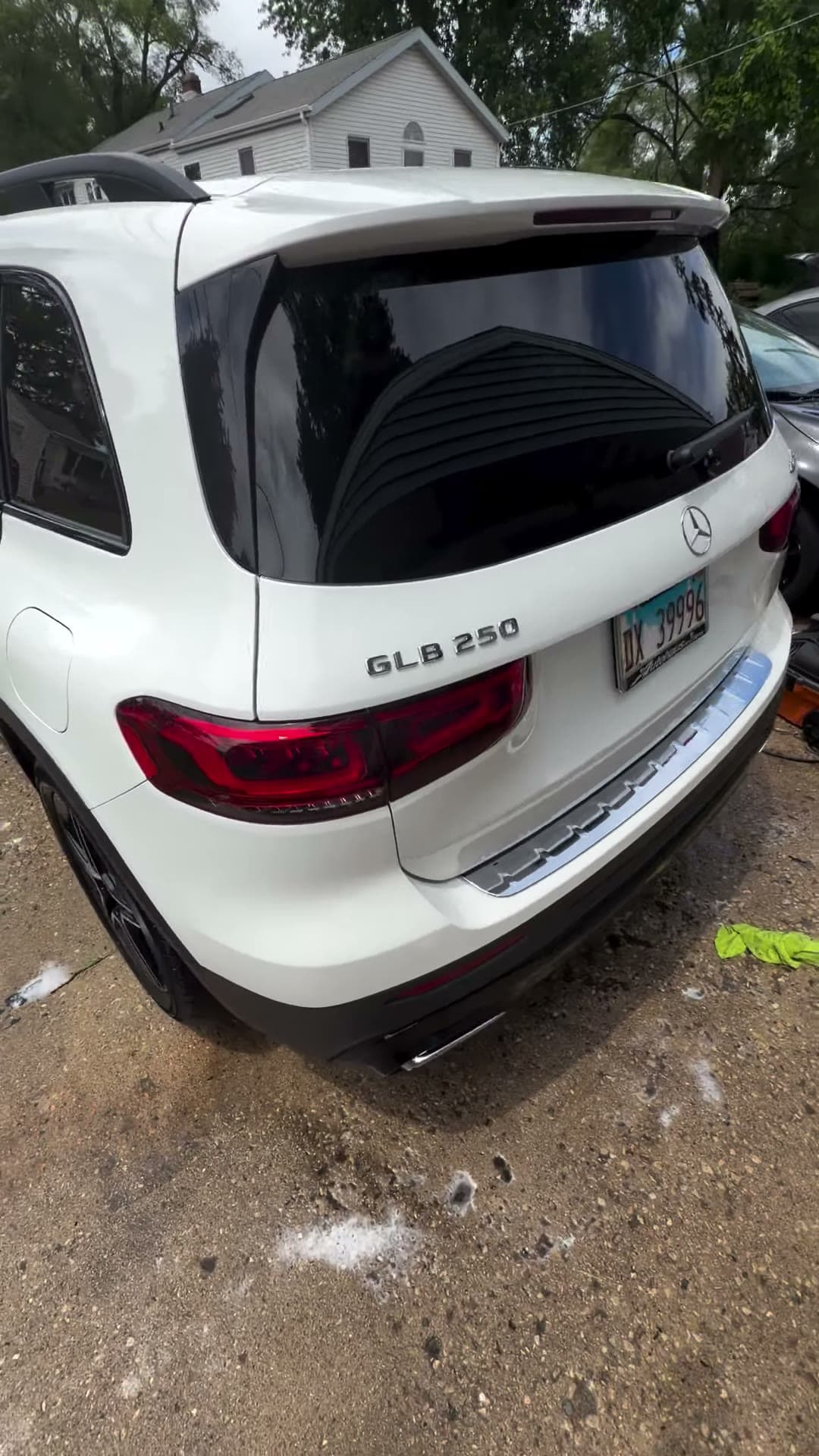 White Mercedes SUV after detailing, viewed from the rear