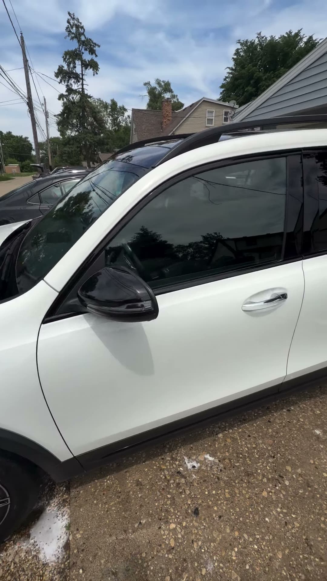 Clean white Mercedes SUV viewed along the side
